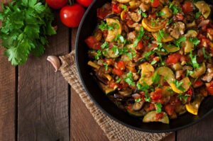 Crohn's friendly ratatouille with eggplant, zucchini, peppers, onions, mushrooms, and tomatoes baked with olive oil and herbs