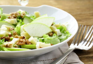 Paleo Waldorf salad with green apples, walnuts, lettuce, and a light dressing