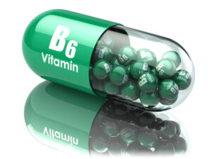 Vitamin B6 supplement capsule illustration with green beads