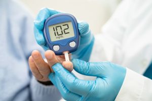 Blood glucose test showing 102 mg/dL indicating early insulin insensitivity