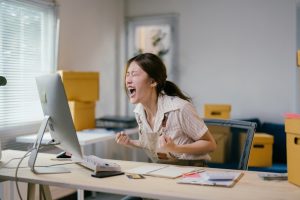 person experiencing stress and frustration at work